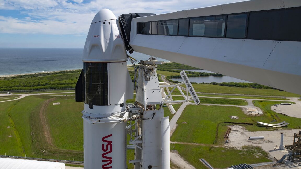 spacex takes down dragon crew arm giving