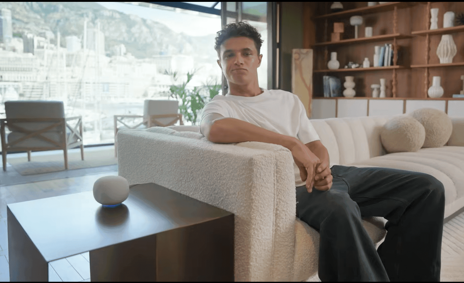 Screenshot from Google’s Pixel 10 keynote showing an unknown home speaker with F1 driver Lando Norris