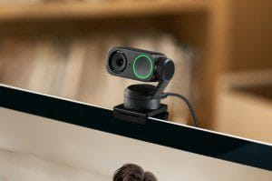The Insta360 Link 2 webcam attached to the top of a laptop screen.