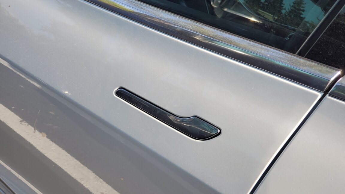 tesla model y door handles now under
