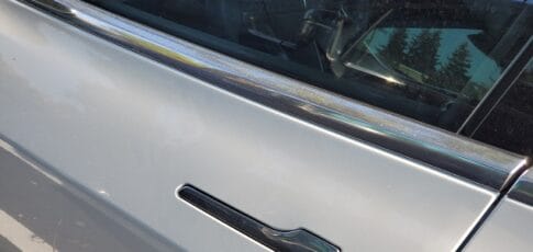 tesla is updating its passenger-trapping door handles