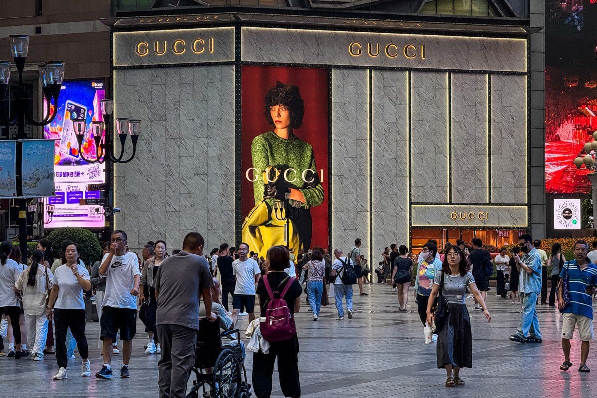 company that owns gucci balenciaga other brands